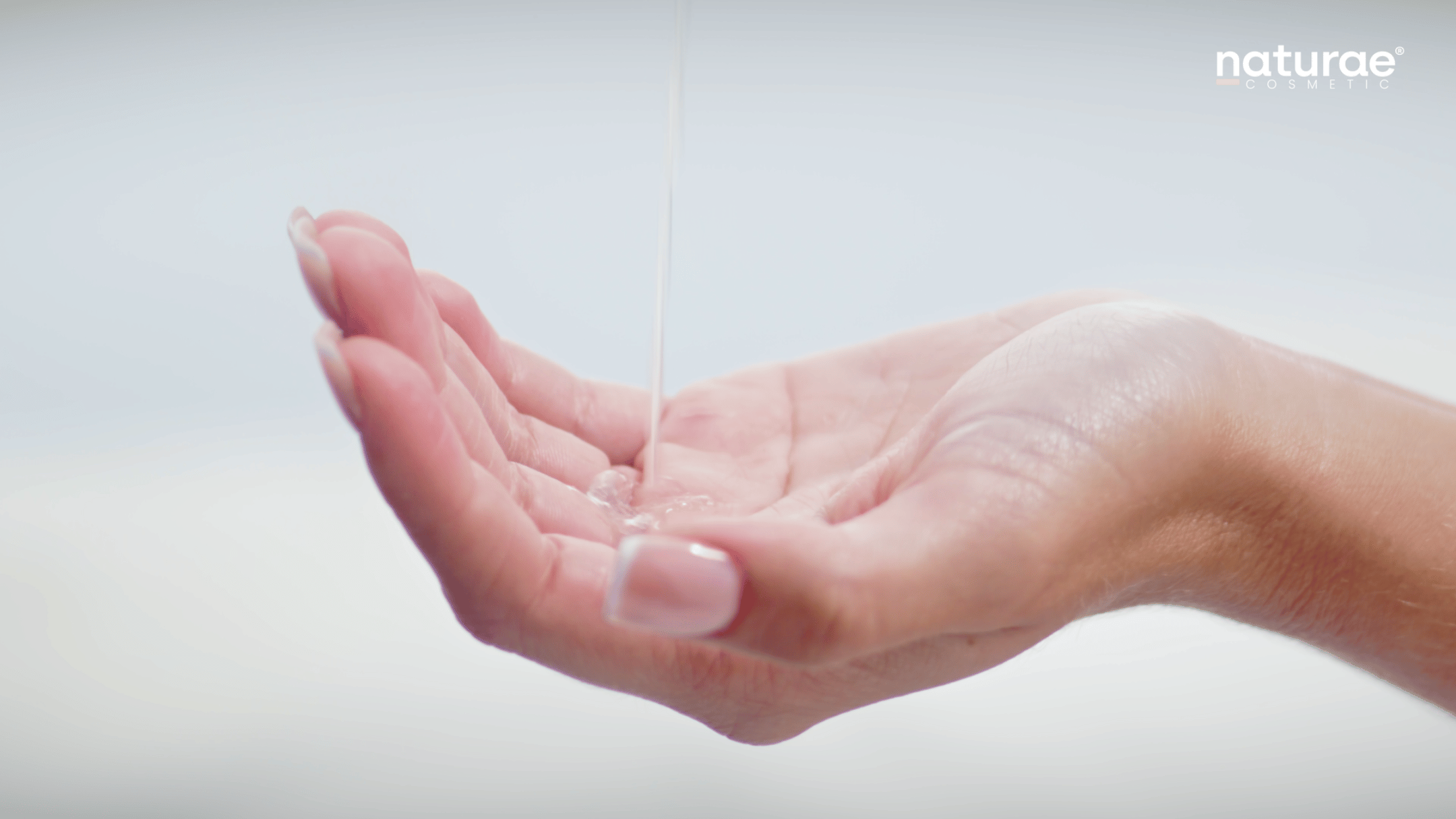 Editorial skincare film still for Naturae Cosmetic showing water in hand by Spaziale Studio
